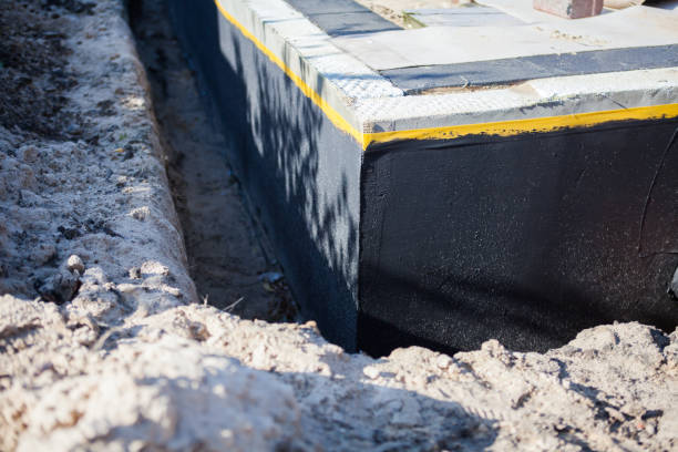 Professional Waterproofing technician working in Centerport, NY